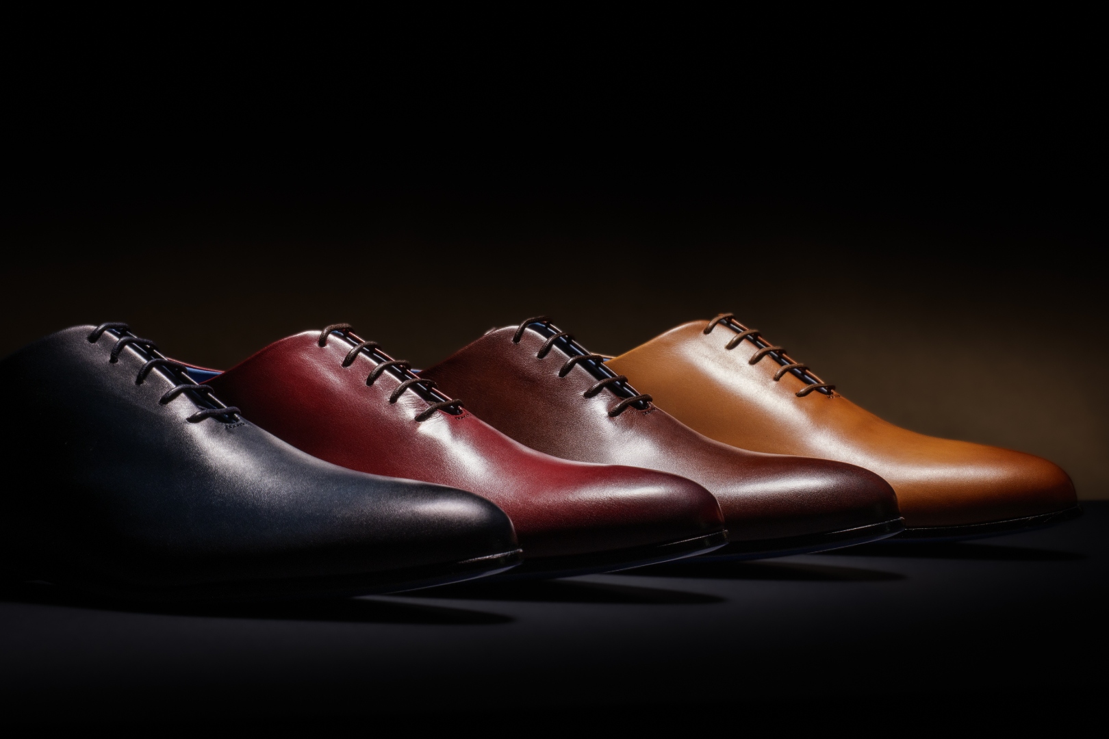 Four Nunzio Orsini Oxford colorways in dark blue, maroon, dark brown and light brown top grain Italian leather, handcrafted in Marche, Italy
