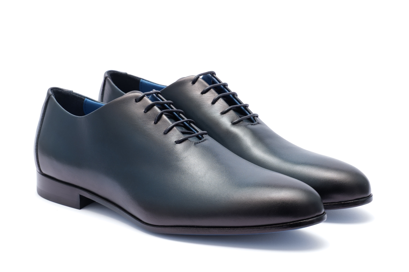 The Nunzio by Nunzio Orsini — angled pair view, signature dark blue whole-cut Oxford in top grain Italian leather
