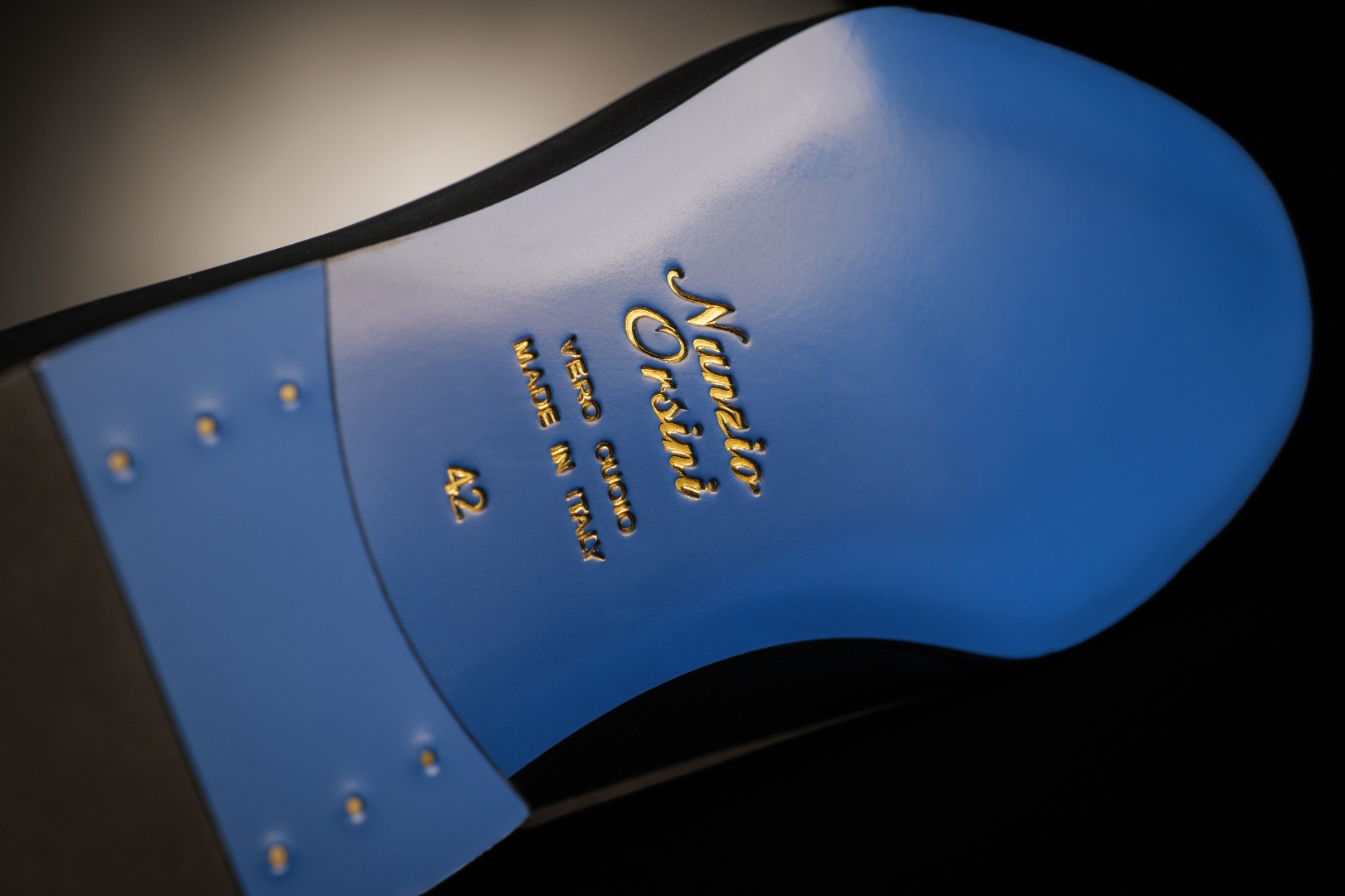 Signature sky-blue Vero Cuoio leather sole stamped in gold, handcrafted in Marche Italy by Nunzio Orsini